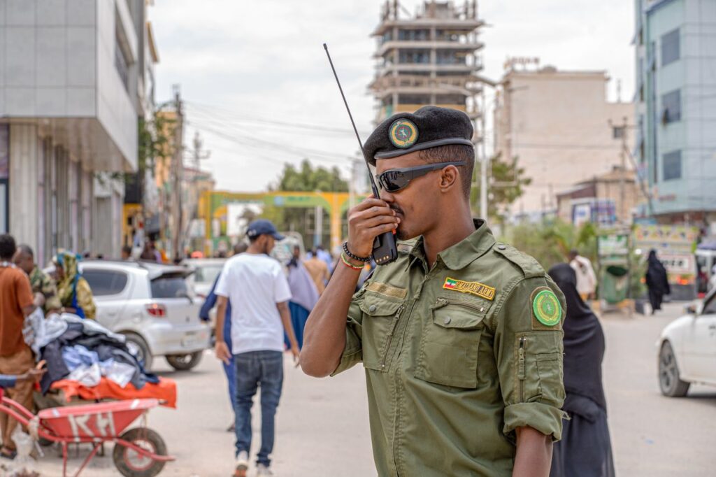 A military officer uses a radio in Hargeisa, Somalia, demonstrating peacekeeping efforts.